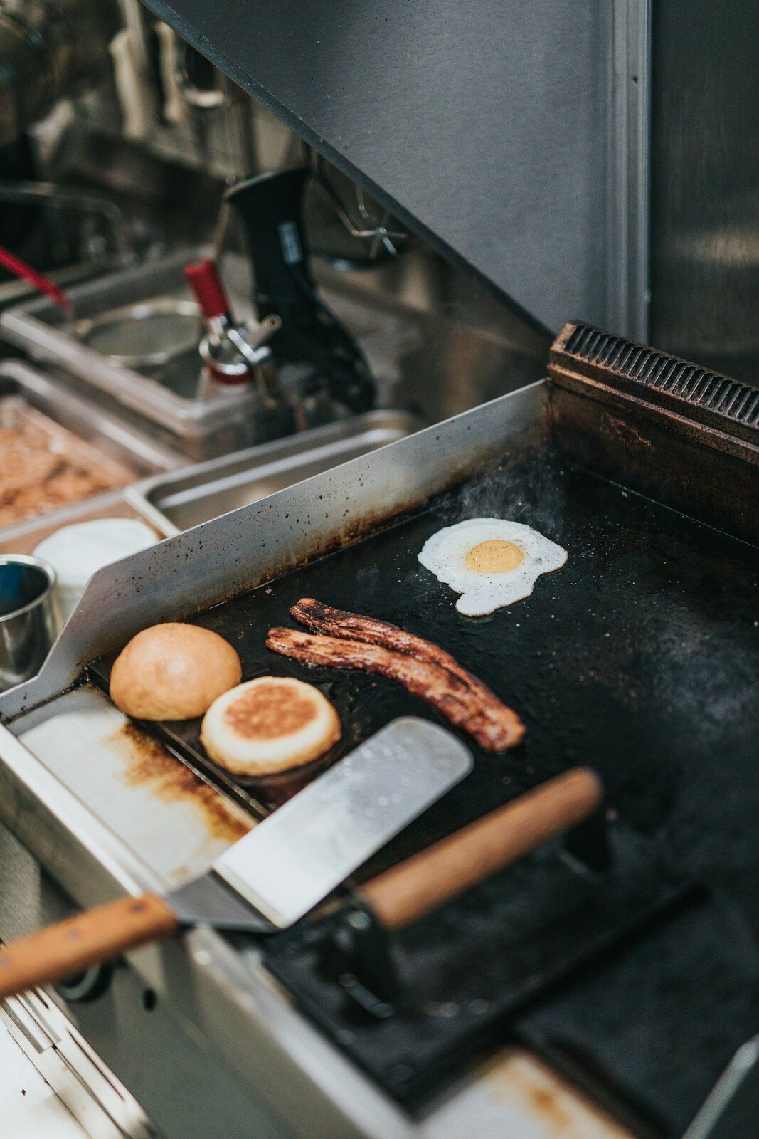 Eggs, bacon and a biscuit on the griddle