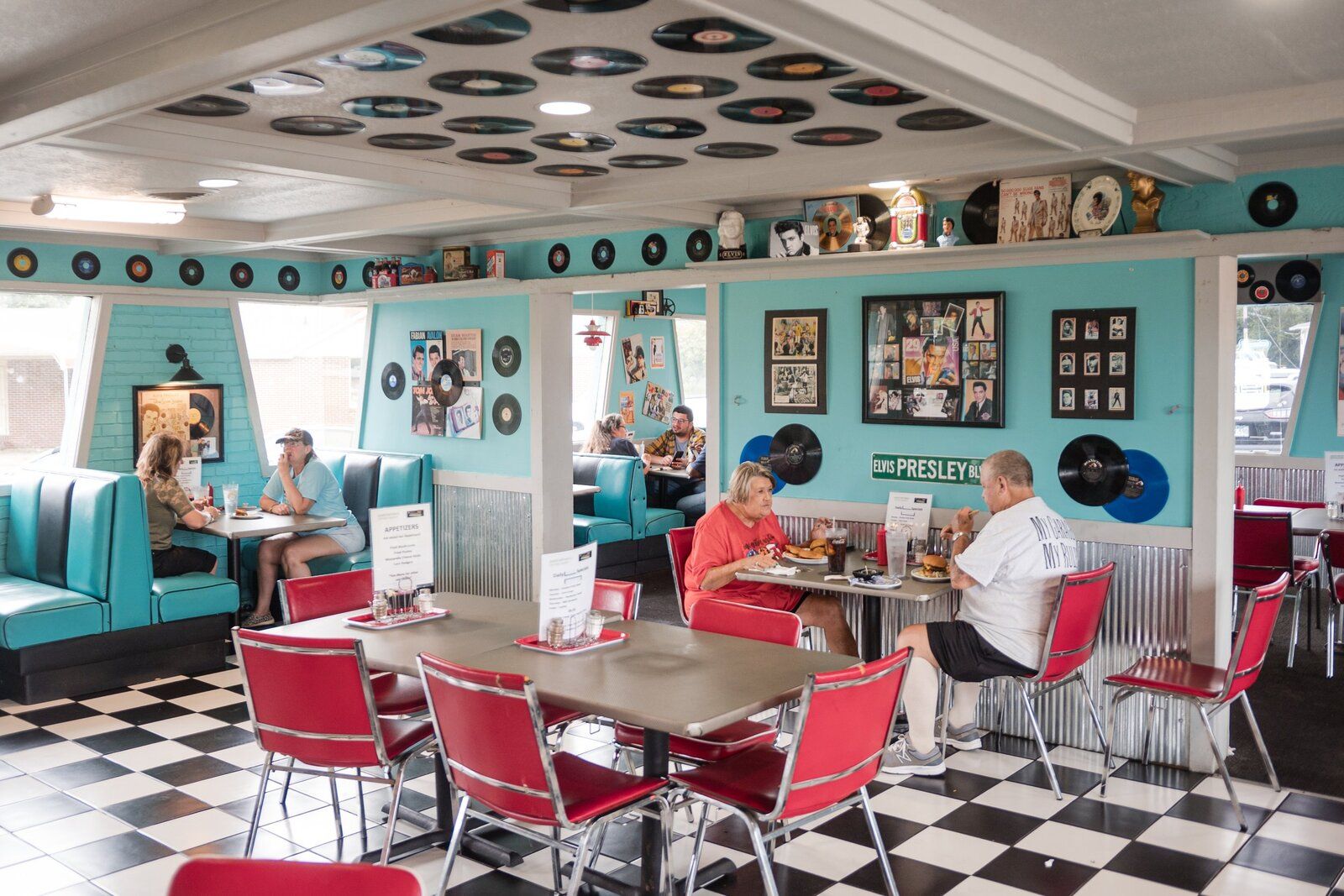 Guests dining under the record wall